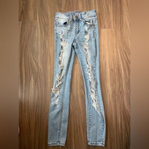 Rue21 Blue Mid Rise Ankle Jeggings with Distressed Detailing size 0